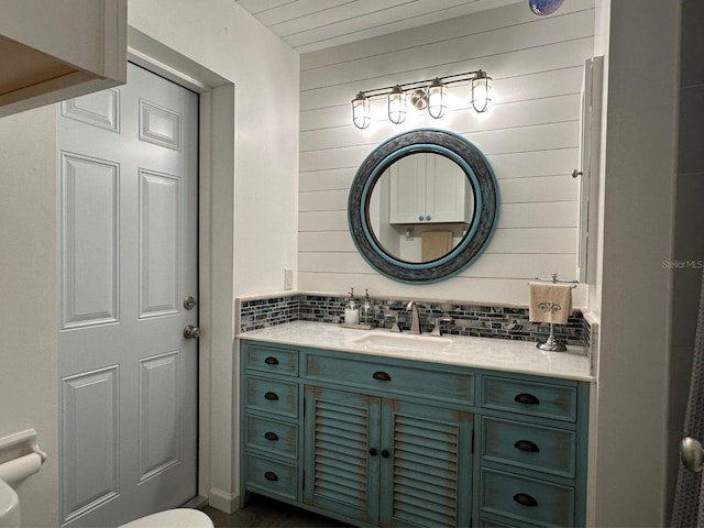 bathroom featuring toilet and vanity