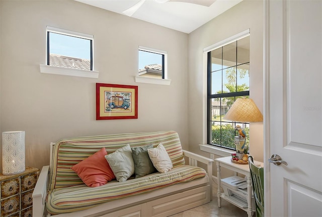 tiled bedroom with ceiling fan