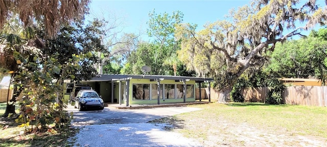 ranch-style home with a front lawn