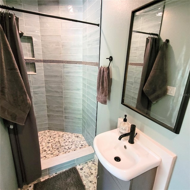 bathroom featuring tile flooring, a shower with curtain, and sink