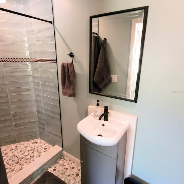 bathroom featuring curtained shower, tile floors, and vanity