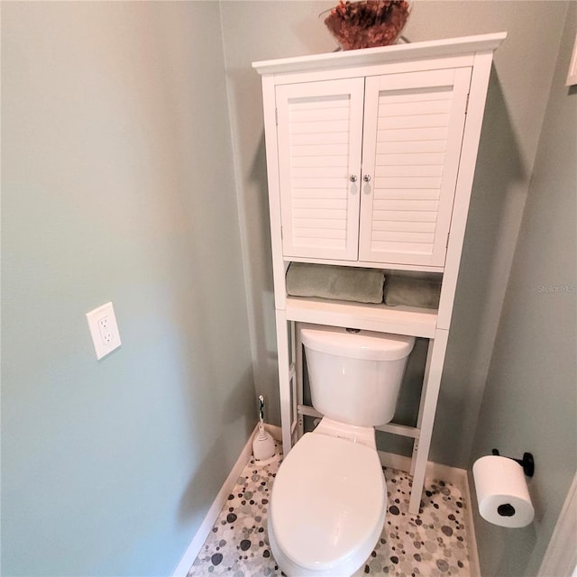 bathroom with tile floors and toilet