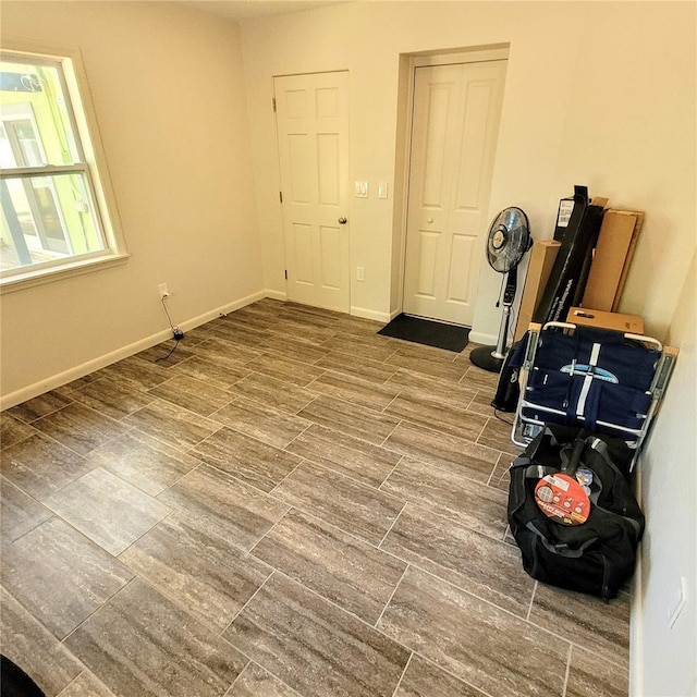 exercise area with dark wood-type flooring