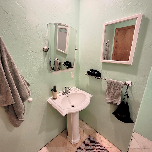 bathroom with tile flooring