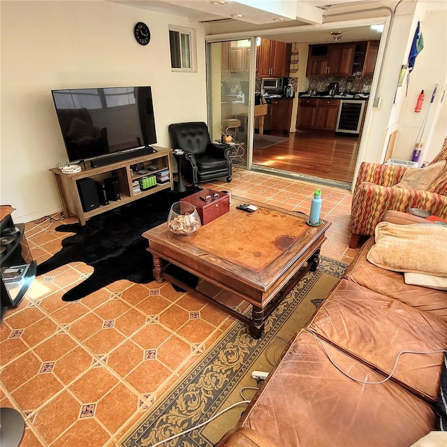 living room with beverage cooler and light tile floors