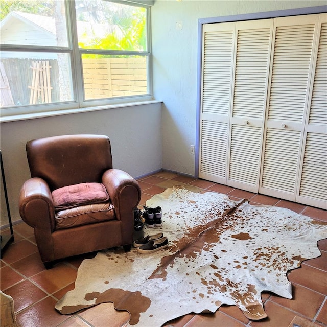 sitting room featuring light tile flooring