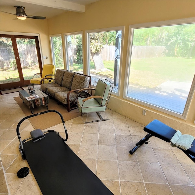 sunroom / solarium with beam ceiling and ceiling fan