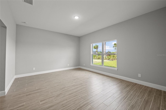 spare room featuring light wood-type flooring