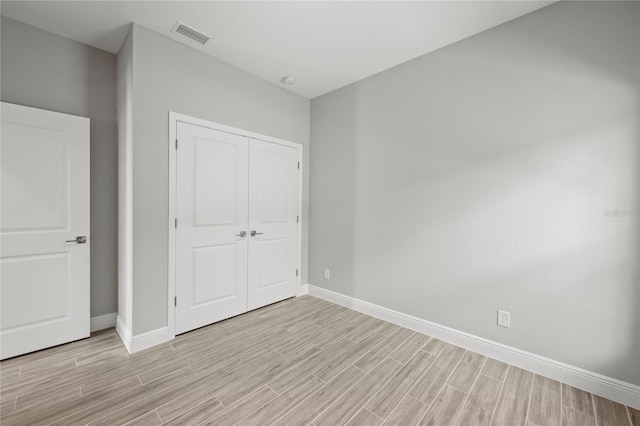 unfurnished bedroom with a closet