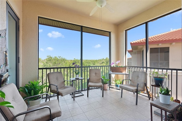 sunroom with ceiling fan and plenty of natural light