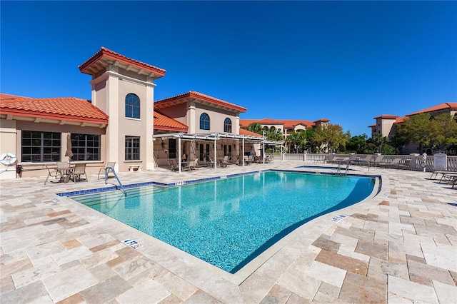 view of swimming pool with a patio area