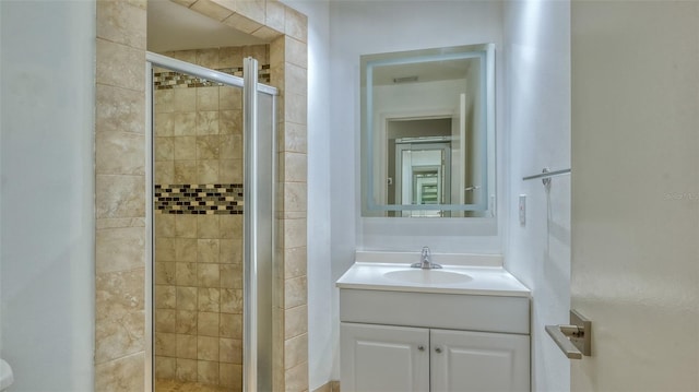 bathroom featuring vanity with extensive cabinet space, toilet, and walk in shower