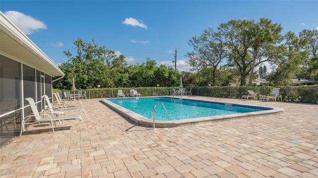 view of pool featuring a patio area