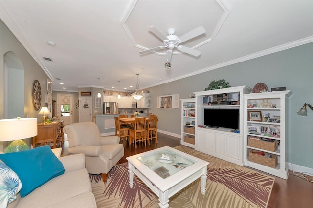 living room featuring crown molding, light wood-type flooring, and ceiling fan with notable chandelier