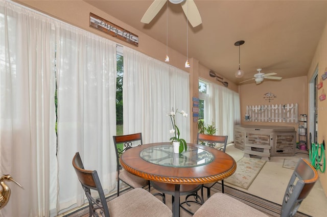 interior space with ceiling fan