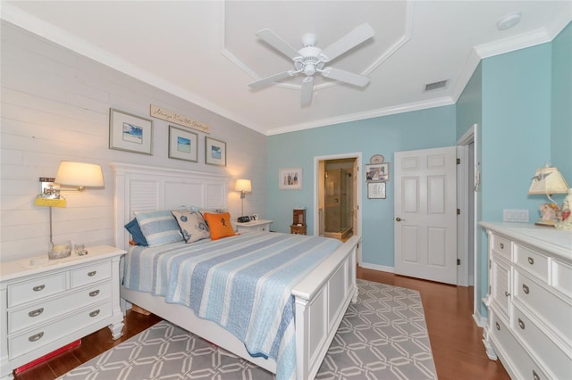 bedroom featuring ornamental molding, dark hardwood / wood-style flooring, and ceiling fan