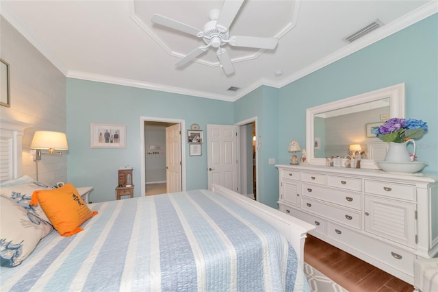 bedroom featuring ornamental molding, ceiling fan, and dark hardwood / wood-style floors