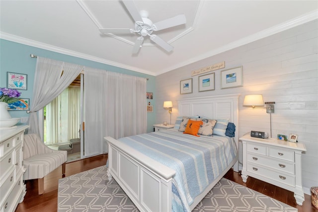 bedroom with ceiling fan, dark wood-type flooring, and ornamental molding