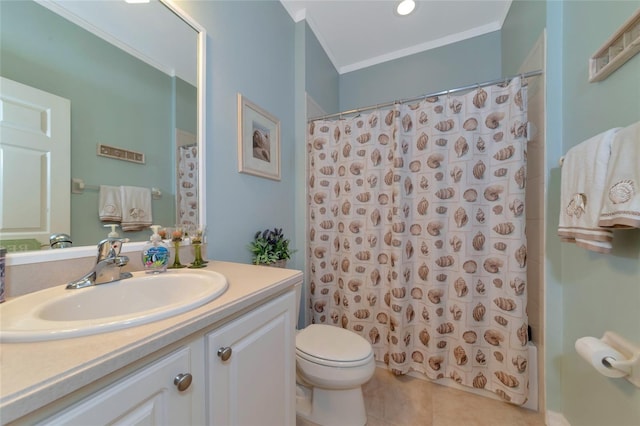 bathroom with tile floors, large vanity, toilet, and ornamental molding