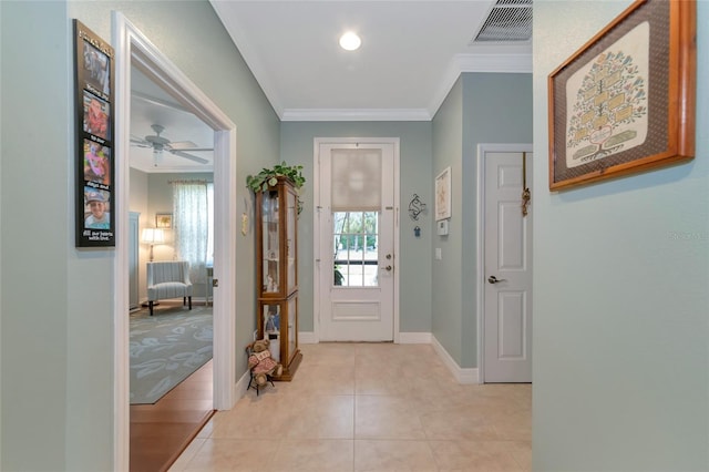 entryway with ceiling fan, light wood-type flooring, and crown molding