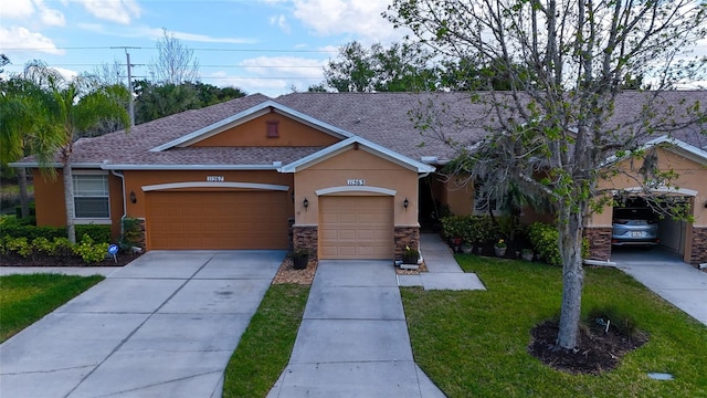 single story home with a front yard and a garage