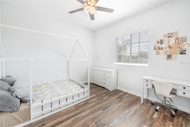 bedroom featuring ceiling fan and hardwood / wood-style flooring