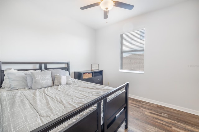 bedroom featuring ceiling fan and dark hardwood / wood-style floors