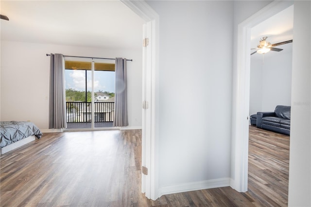 corridor featuring hardwood / wood-style floors