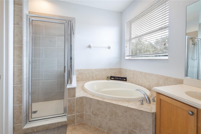 bathroom with separate shower and tub, vanity, and tile flooring