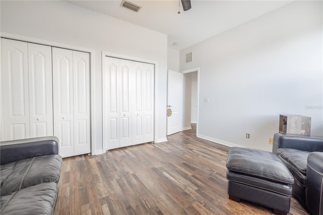 sitting room featuring ceiling fan and dark hardwood / wood-style flooring