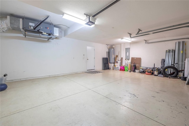 garage featuring a garage door opener and water heater