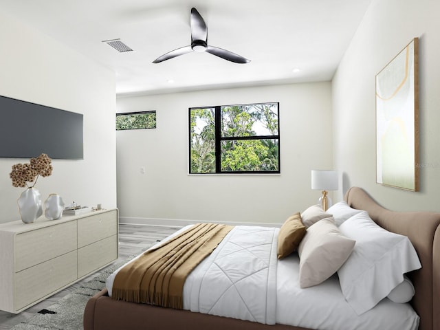 bedroom featuring light hardwood / wood-style flooring and ceiling fan