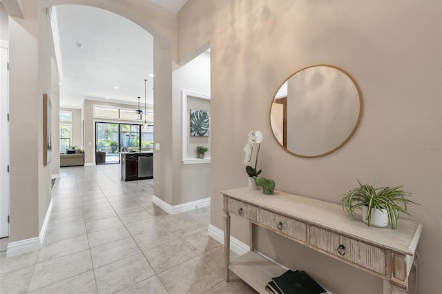 corridor featuring light tile floors