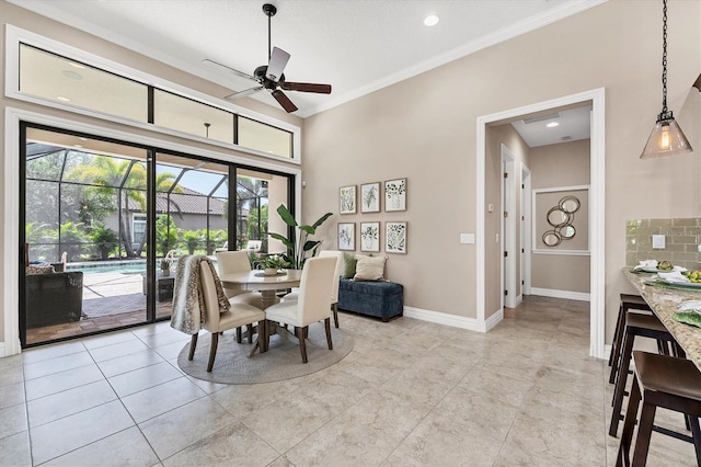 tiled dining space with ornamental molding and ceiling fan