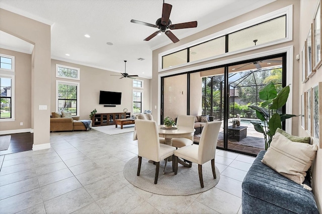 dining room with ceiling fan, light hardwood / wood-style flooring, and ornamental molding