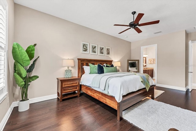 bedroom featuring ceiling fan, dark wood-type flooring, and connected bathroom