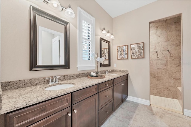 bathroom with double sink, tile floors, and large vanity