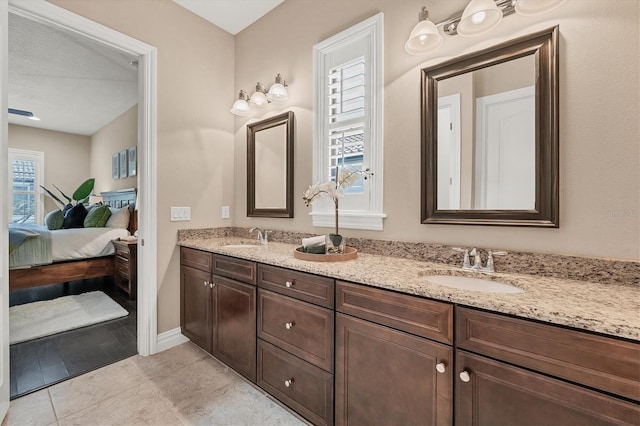 bathroom featuring dual vanity and tile floors