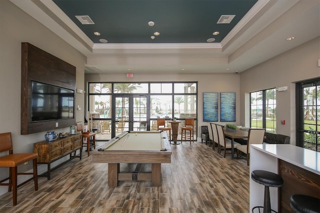 rec room featuring billiards, dark hardwood / wood-style floors, and a raised ceiling