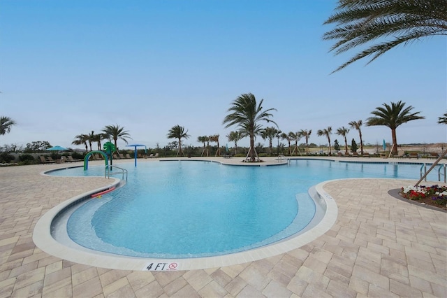 view of swimming pool featuring a patio