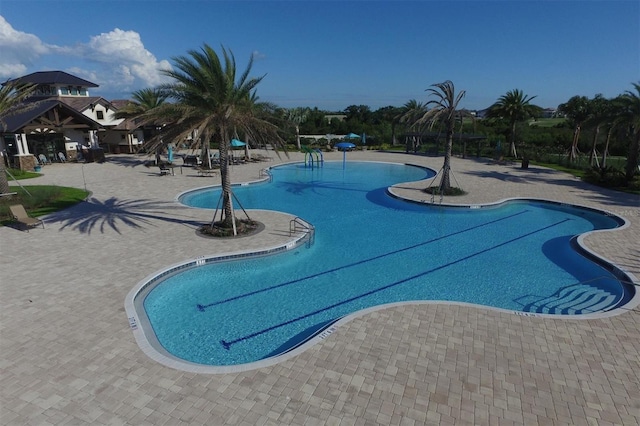 view of pool featuring a patio area