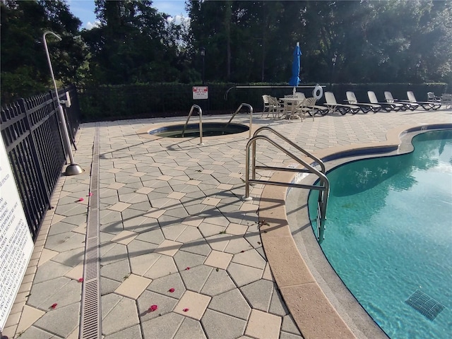 view of pool featuring a patio