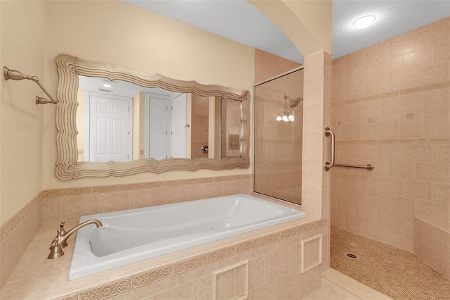 bathroom with separate shower and tub