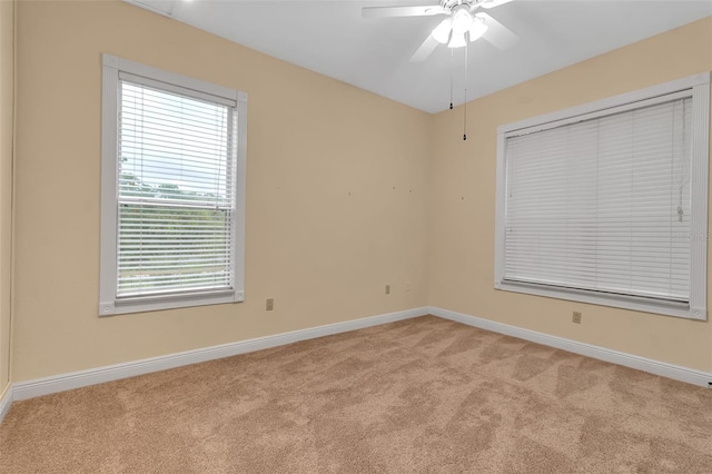 empty room featuring light carpet and ceiling fan