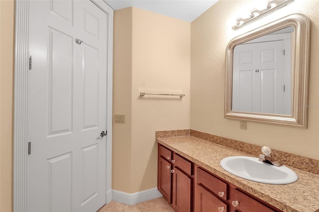 bathroom with tile patterned flooring and vanity