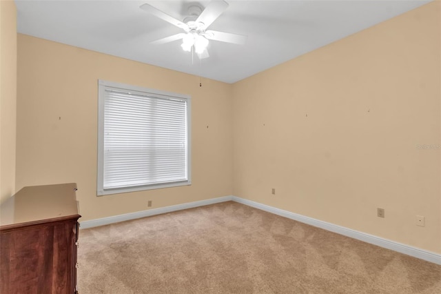 empty room with light carpet and ceiling fan