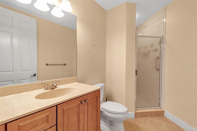 bathroom with tile patterned floors, vanity, toilet, and a shower with shower door