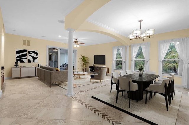 dining room featuring ceiling fan with notable chandelier, ornate columns, and ornamental molding