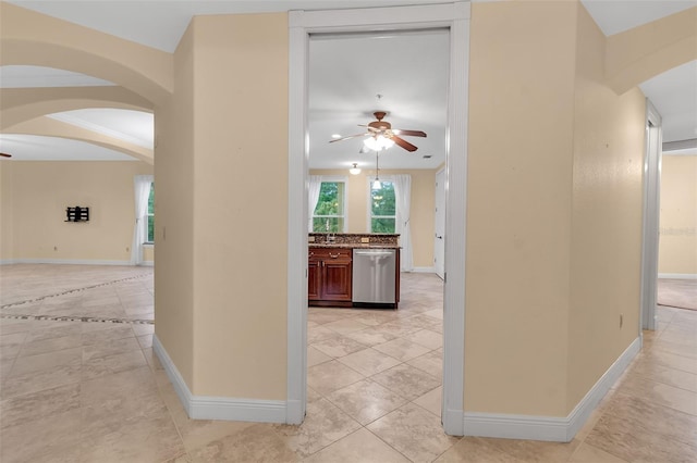 hall featuring light tile patterned flooring