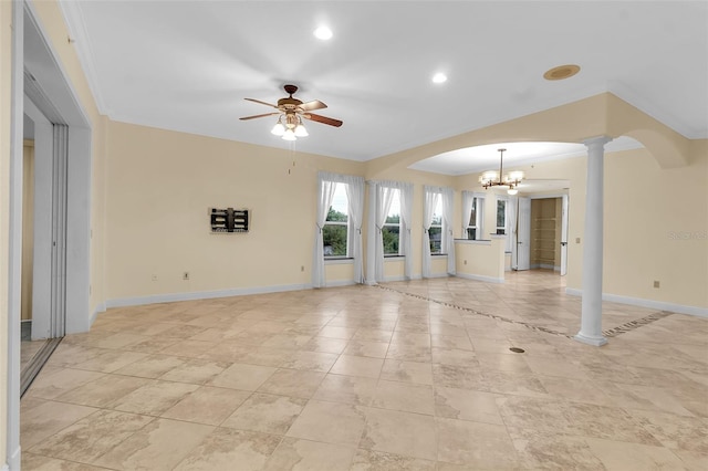 unfurnished living room featuring ceiling fan with notable chandelier, ornate columns, and crown molding